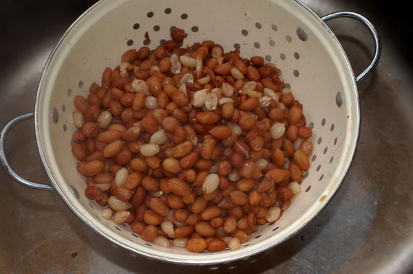Strain the nuts into a colander.