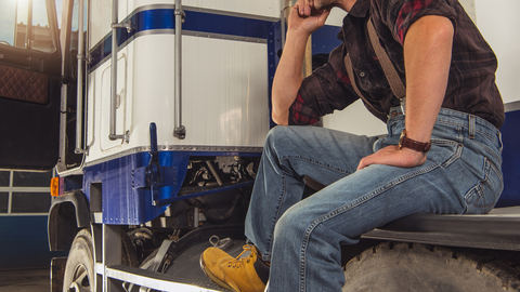 Semi Truck Driver Waiting For His Trailer to be Loaded