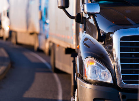 Semi truck in fronf of convoy