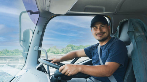 truck driver bearded man smiling fasten seat belt
