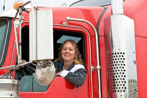 Woman driving an truck trailer