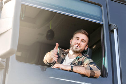 Young man driving modern truck