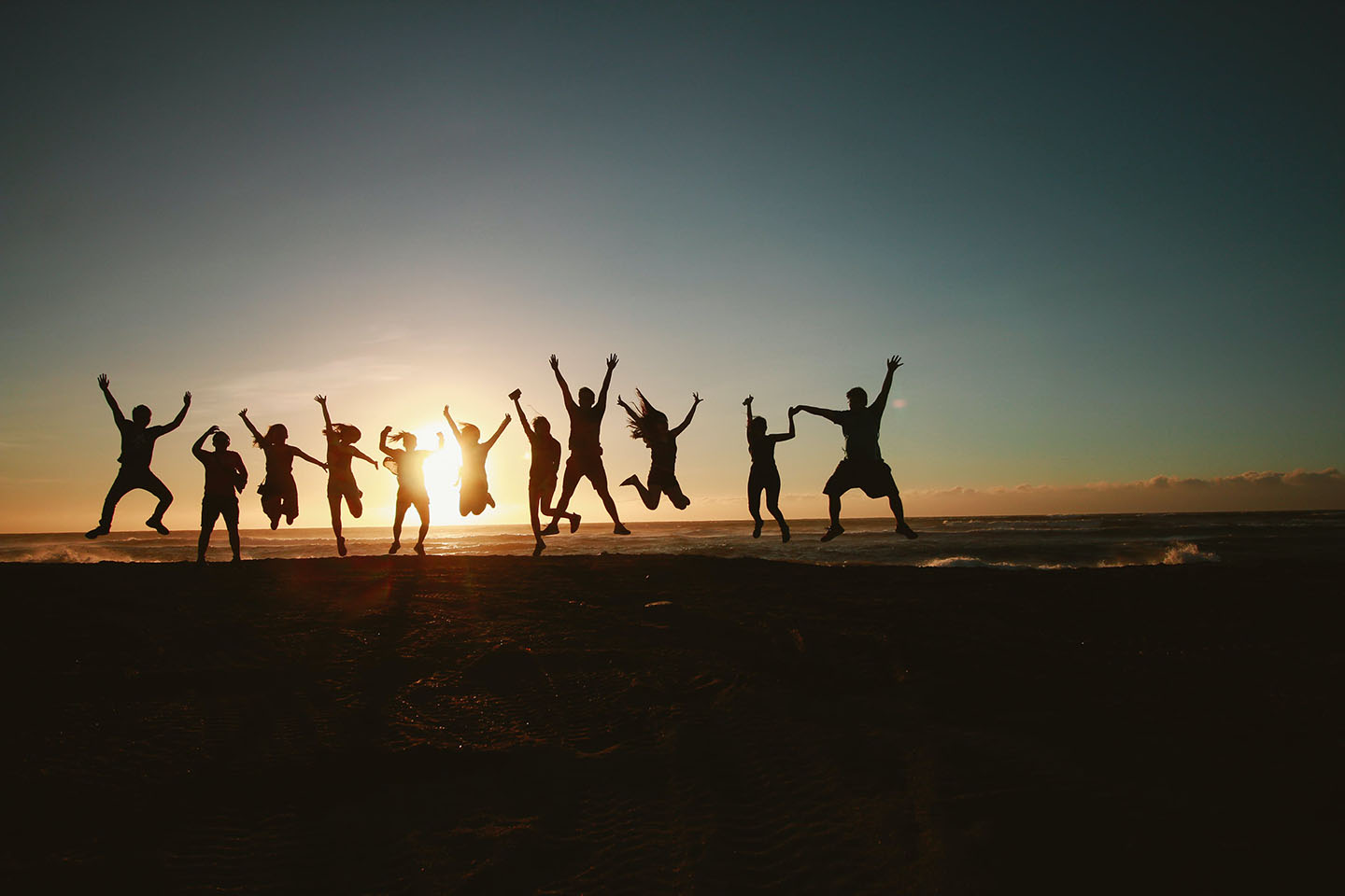 Group of people jumping in silhouette