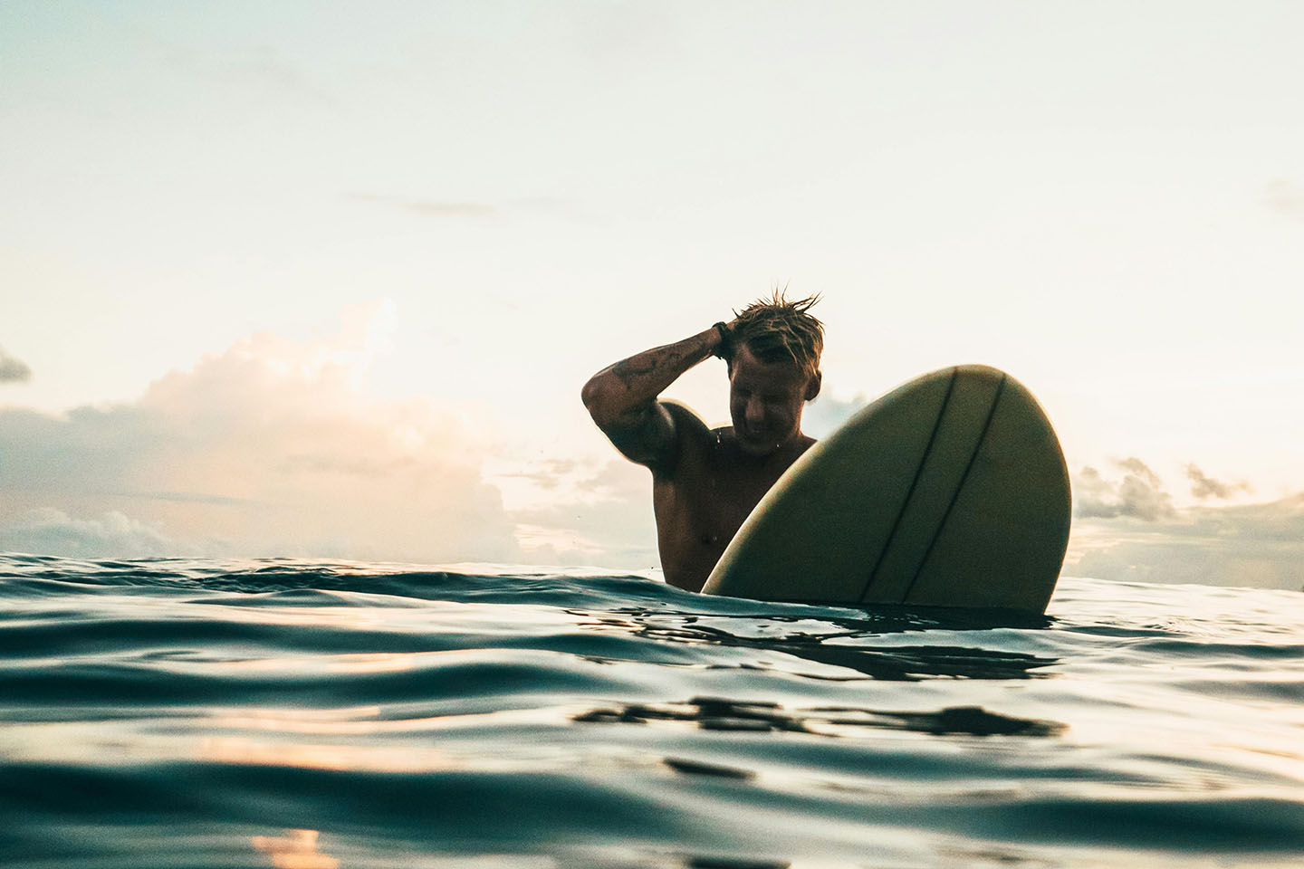 Man in the water on a surboard