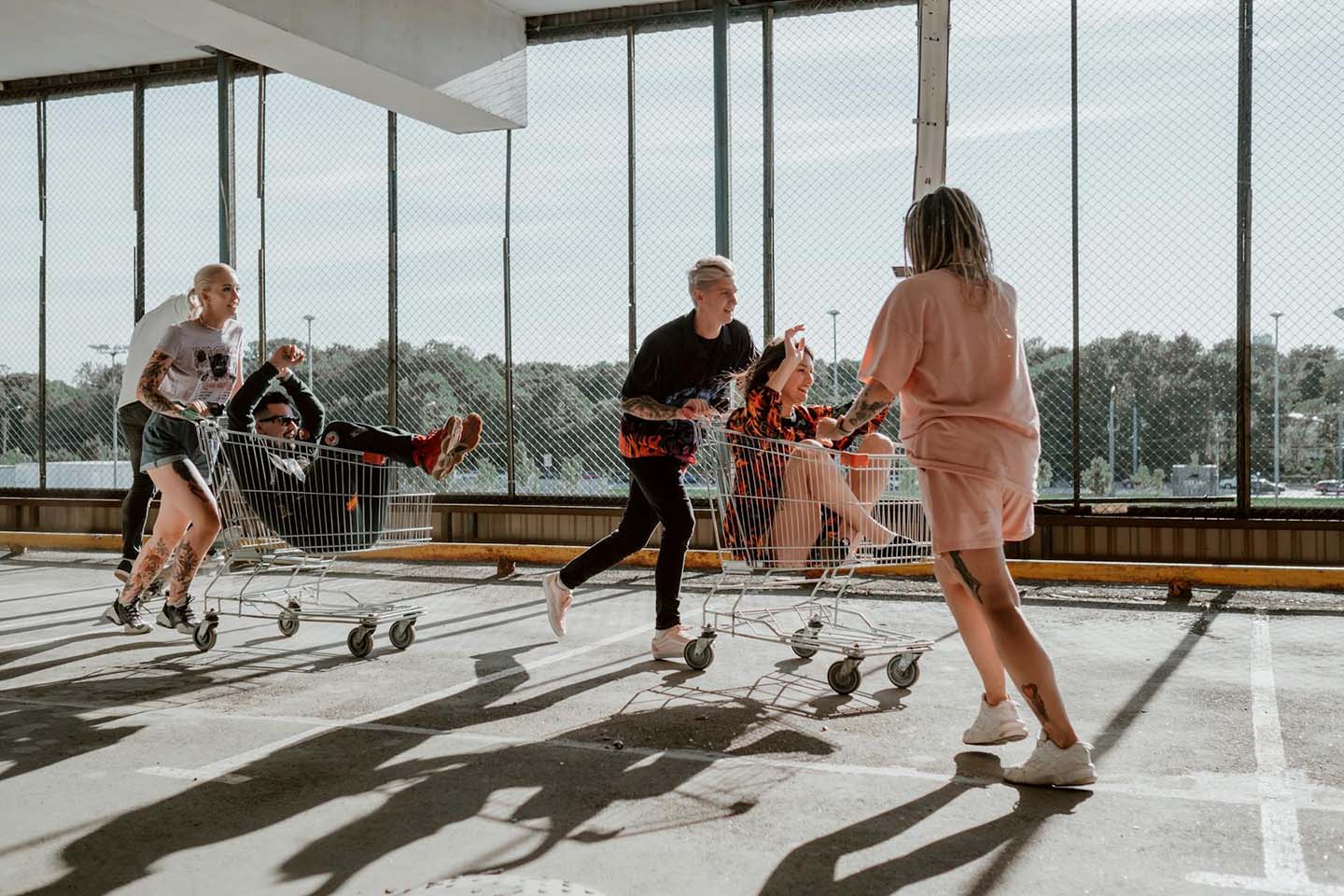 a group of friends having fun inside a parking deck