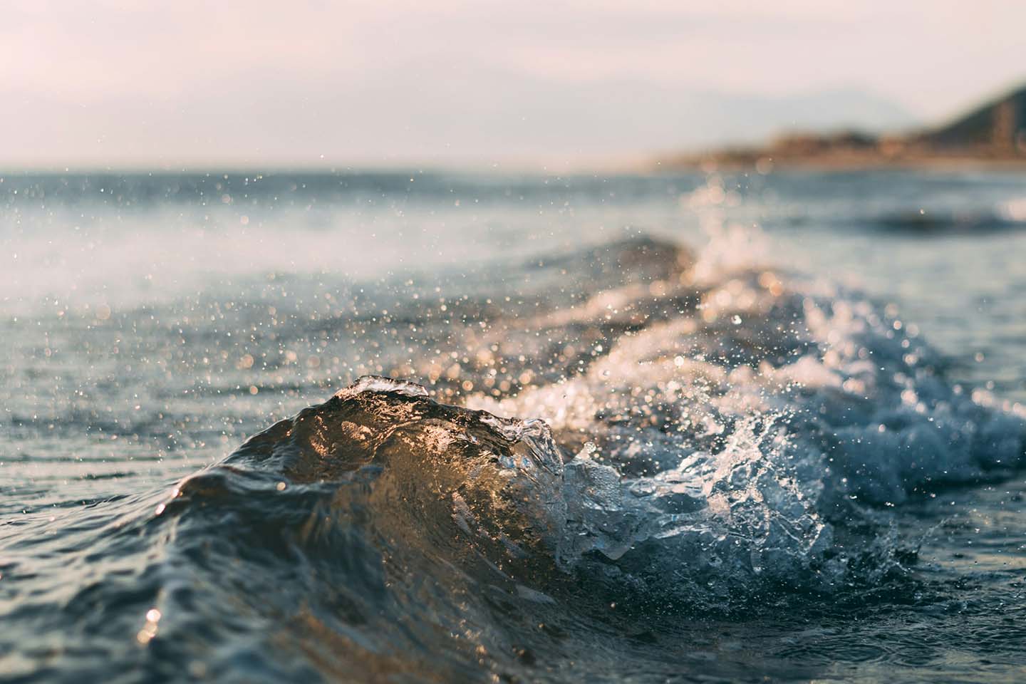 close up photograph of an ocean wave at the beach