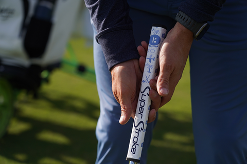 Limited edition The Bryan Bros putter grip held by a golfer