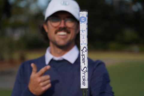 George Bryan holding The Bryan Bros limited edition putter grip