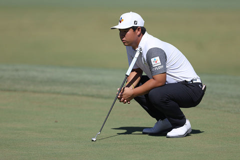 Tom Kim, PGA Tour player, lines up his putt at the Shriners Children's Open