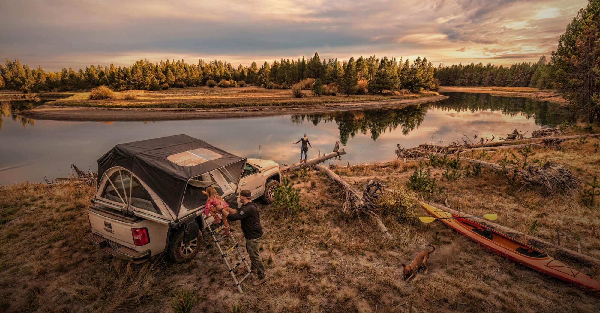 Family overlanding near the river