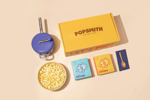 the contents of a Popsmith starter set include a popper, one box of Oh Sooo Buttery Popcorn, and one box of Classic Kettle Popcorn