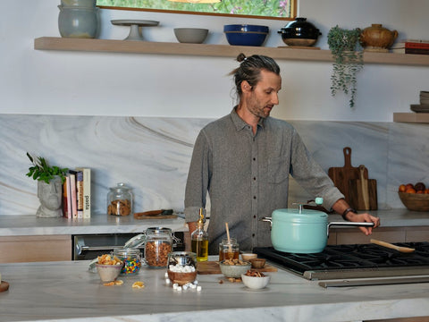 Man prepares ingredients needed for stovetop popcorn