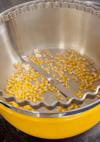 kernels inside a stovetop popcorn popper