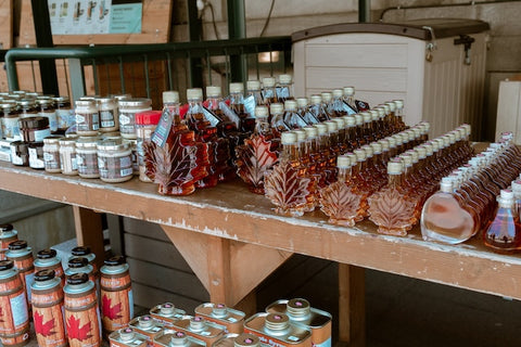 Bottles of maple syrup in a table