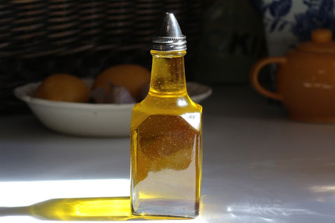 a glass bottle with olive oil