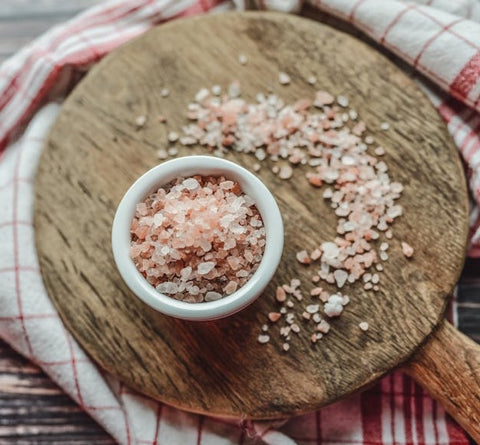 pink salt in a white bowl
