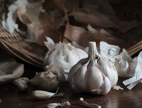 white garlic on wooden table
