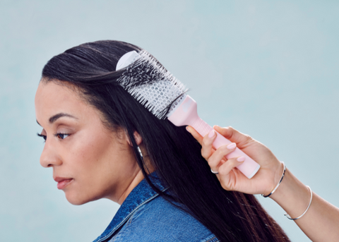 Black woman with Mane's BRB Ceramic Round Brush being used in her straight black hair