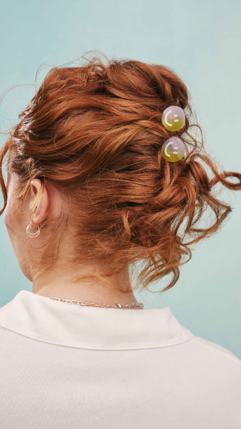 Person with Smile! Mini Hair Clips in curly red hair updo