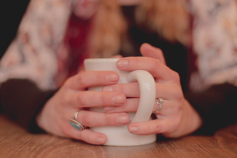 woman holding a cup of tea