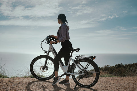 woman in a sport outfit riding a bike