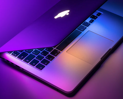 MacBook pro (air) laptop sitting on the desk in a modern futuristic office