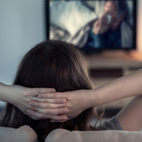 a person relaxing while watching tv