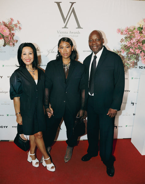 Philipp Enders family alaba standing in front of vienna awards banner 1c1y outfits