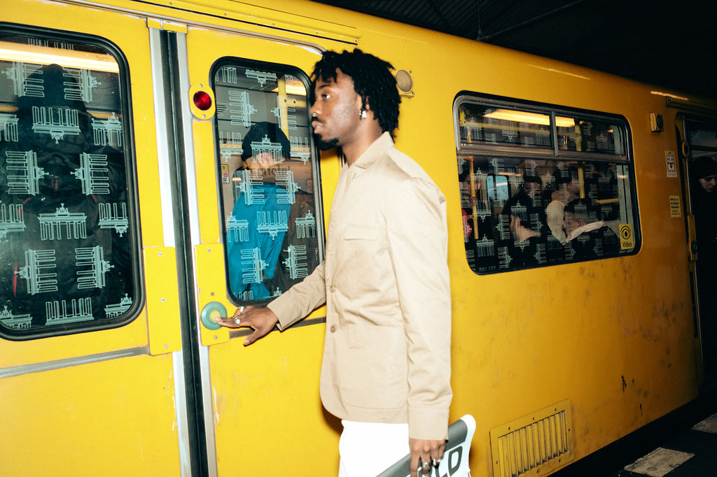 1c1y man in suit in front of train