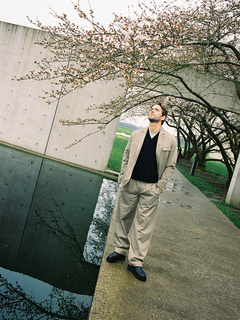 Ben Dahlhaus Standing in brown suit