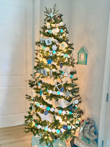 Fully completed Coastal Christmas tree with DIY topper and beachy ornaments