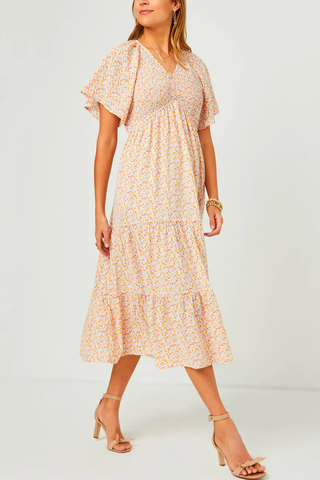 A woman in a cute but modest midi summer dress. 