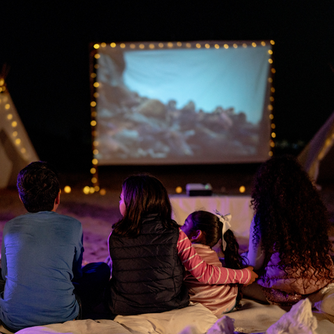 Kids enjoying an outdoor movie night