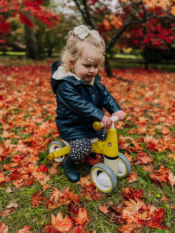 Girl riding Diditrike Giraffe Christmas present