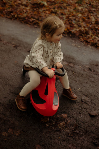 Girl riding her Red Didicar