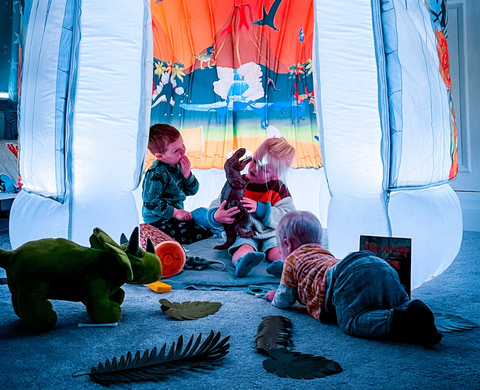 children playing inside sensory pods play