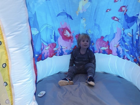 child in sensory space pod