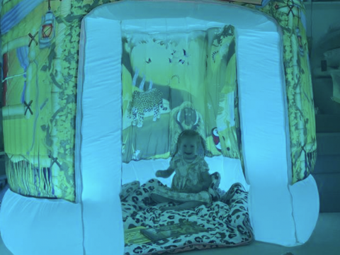 child playing in sensory tent 