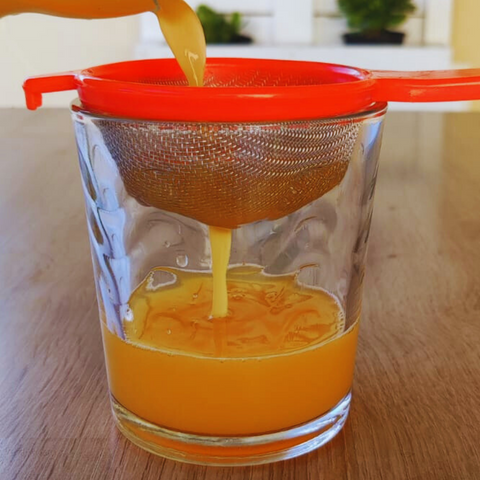 strain orange juice before freezing