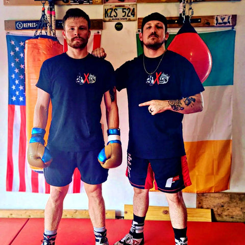 Coach Ryan Mosburg and Professional Boxer Theran Cade Posing For A Picture At The Mosburg Boxing Gym