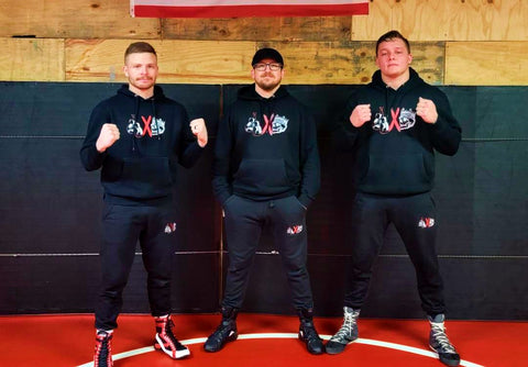 Mosburg Boxing athletes posing wearing the mosburg boxing joggers and hoodie from king killers apparel