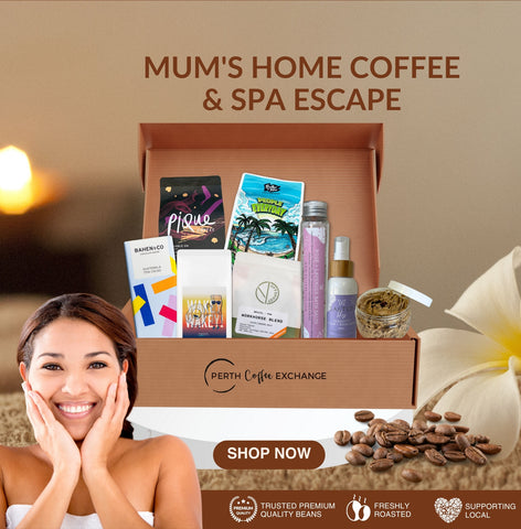 An advertisement for "Mum's Home Coffee & Spa Escape" featuring a gift box with coffee and spa products. A smiling woman is shown in the corner with a warm background, promoting Perth Coffee Exchange.