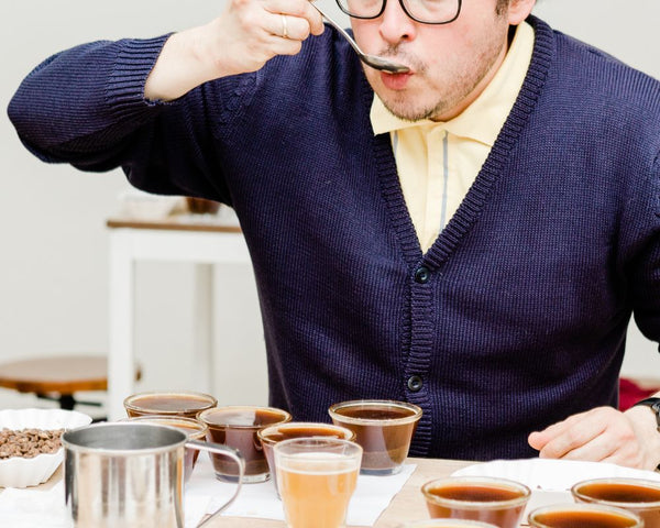 A Perth Coffee Roaster cupping the coffees to discover the tastes that have been roasted out of the coffee beans