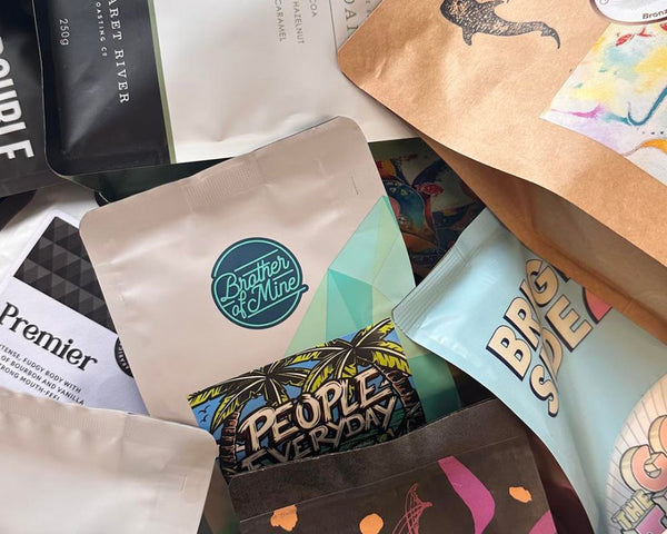 Bags of specialty coffee beans from a variety of Perth's best coffee roasters arranged in a montage style photo