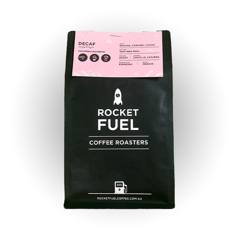 Rocketfuel decaf 250 gram bag with pink information card stapled to the top of the bag