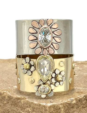 Stack of two wide solid gold and Diamond alternative engaement rings with flowers
