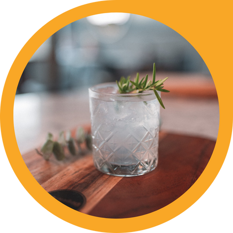 Rocks glass of Fury, Elderflower tonic and smoked Rosemary