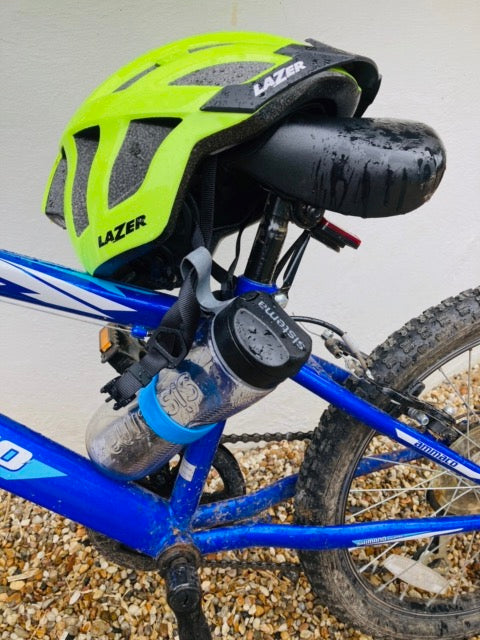 Water bottle with bottle band on mountain bike