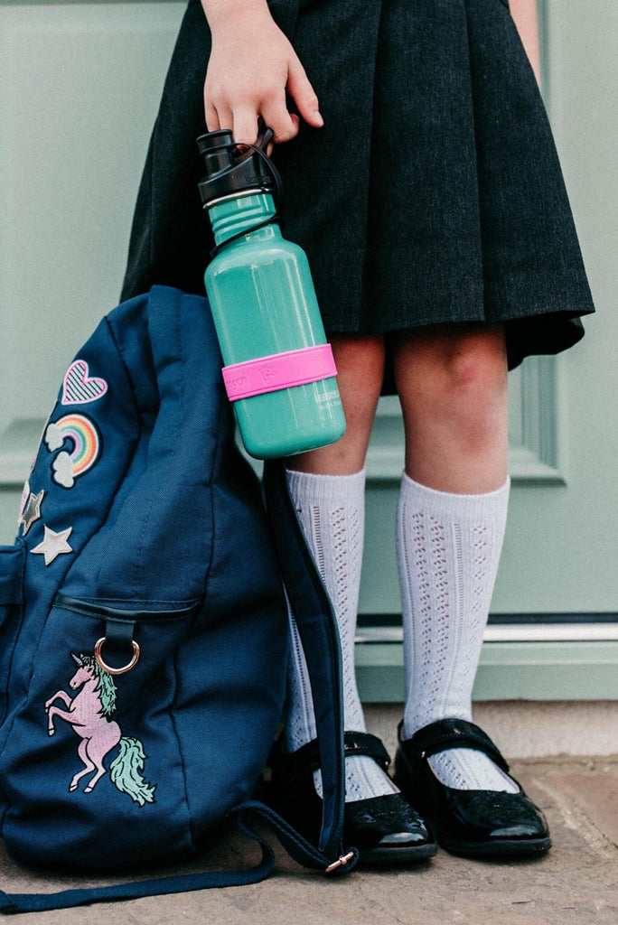 School Kid Carrying Bottle