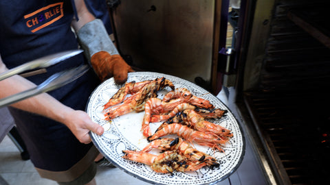 Plating the prawns at the charlie oven fish and seafood masterclass